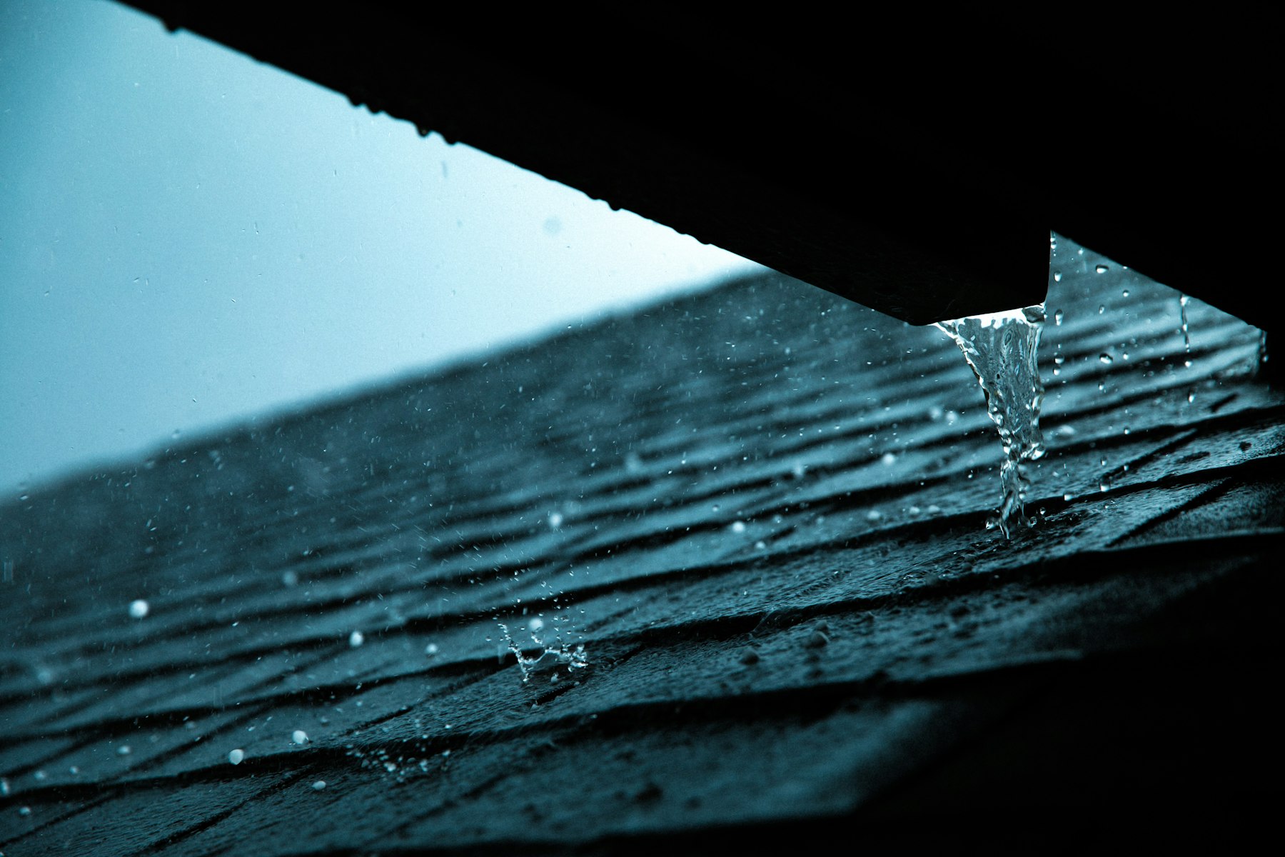 Rain running off a roof into the gutter on a Nashville home during a Middle Tennessee storm